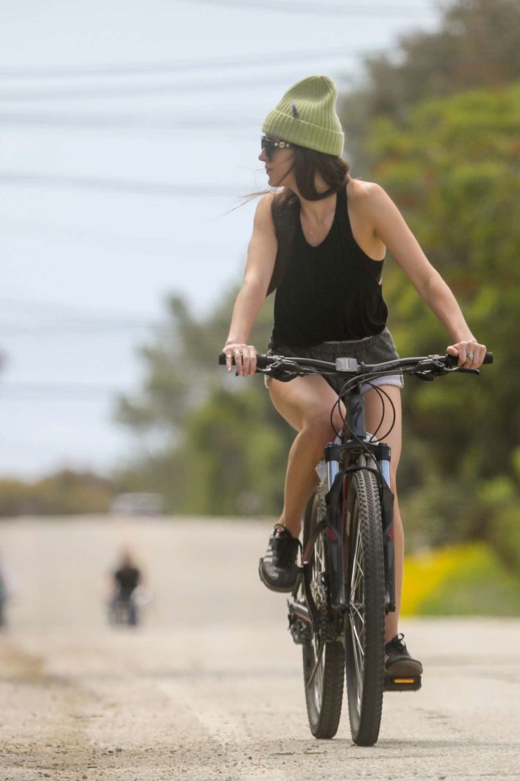 Dakota Johnson Riding A Bicycle In Malibu